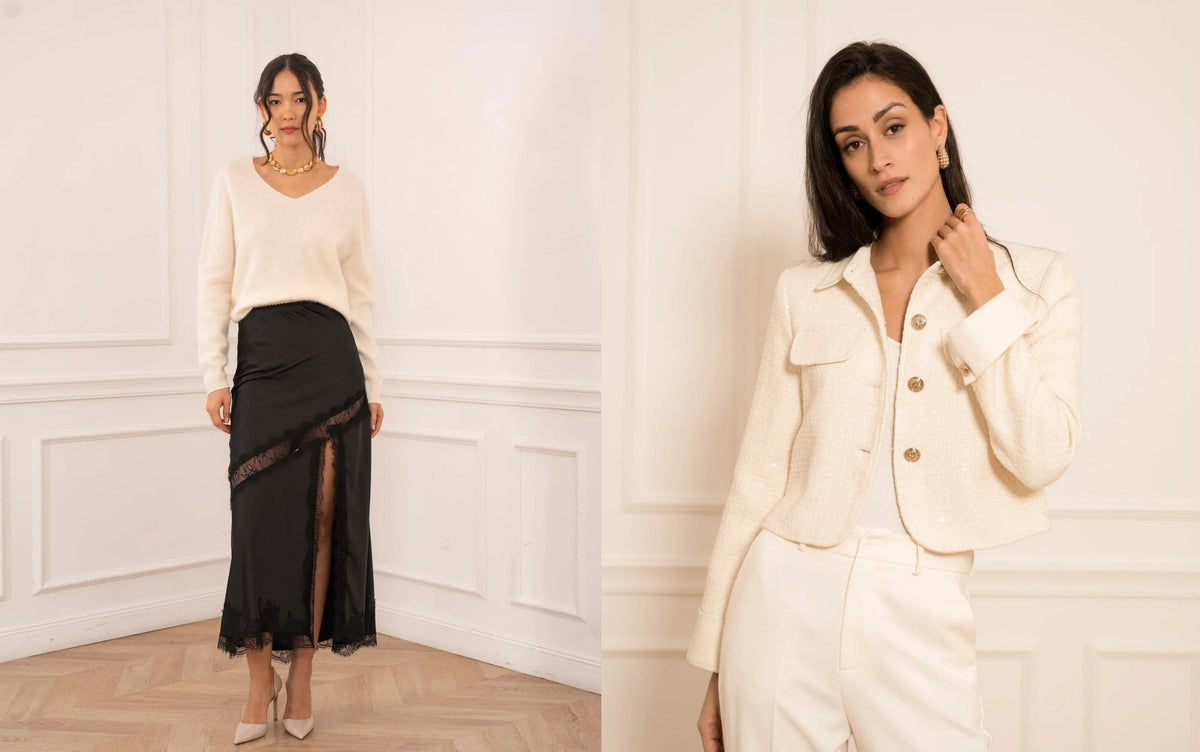 A split-screen fashion photo showing a woman modeling two different outfits in a bright, white-paneled room. On the left, she wears a cream V-neck sweater and a black midi skirt with a sheer side slit.