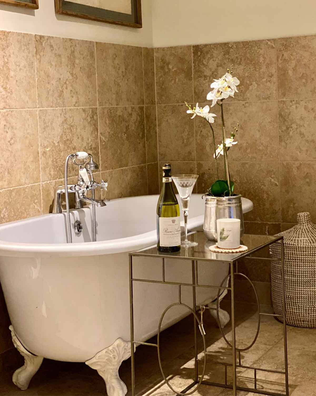 Metal structure side table with glass top.