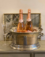 Large silver champagne ice bucket.
