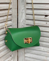 Green cross body bag with gold bamboo clasp. With adjustable clasps on the sides.