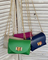 Pictured are all leather cross body bags with gold bamboo clasp and gold attachable chain.