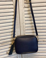 Navy leather tassel bag with side tassel with adjustable long cross body strap.