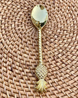 Brass tea spoon with a pineapple at the end.