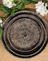 One small, one medium and one large woven black round rattan tray.