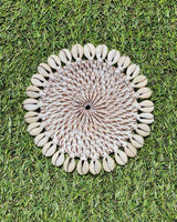 Rattan coaster painted white edged with sea shells.