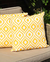 White Gingers Outdoor water repellent cushions printed in a orange ikat print.
