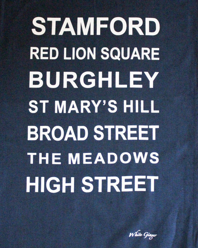Navy tea towel printed with the famous locations in Stamford.